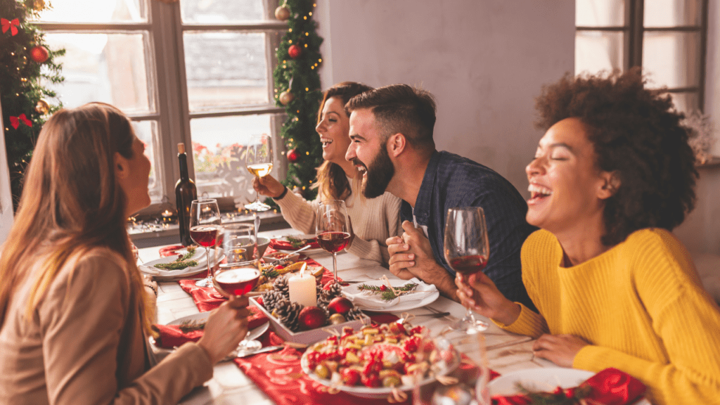 Woman smiling while enjoying Christmas dinner – managing Christmas food anxiety.